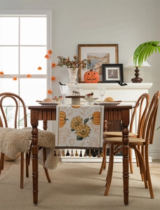 Close-up of fall table runner featuring sunflower and pumpkin jacquard with tassels