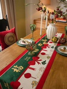 Macro detail of festive table runner with Chinese Fu character and red bow patterns