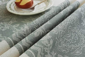 Detailed view of Morandi green jacquard tablecloth with thick European floral pattern texture