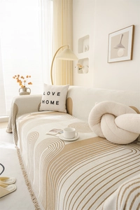 Detail of Nordic chenille sofa cover with geometric patterns and tassel fringe edges