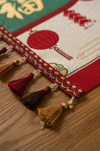 Close-up of Chinese New Year table runner featuring Fu character and festive tassel detail
