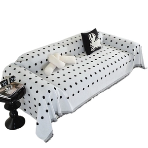 Nordic chenille sofa cover with black polka dots and fringe details for full protection