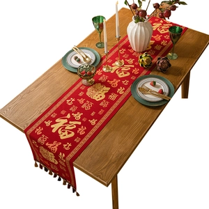 Chinese New Year red table runner with gold Fu characters and festive tassels