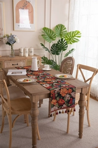 Macro detail of American vintage floral jacquard table runner with decorative tassels