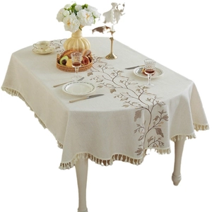 Elegant off-white rectangular tablecloth with brown leaf embroidery and tassels