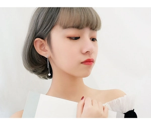 Minimalist S925 sterling silver long drop earrings on model with geometric circles