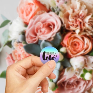 Romantic round Valentine's Day sticker with 'You Are My Love' text held against flowers