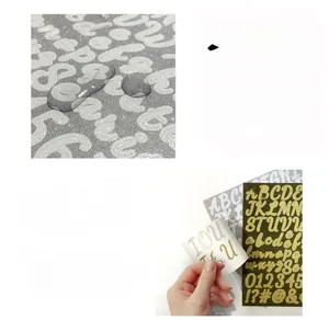 Close-up of 1-inch waterproof gold and silver glitter alphabet stickers for DIY decoration