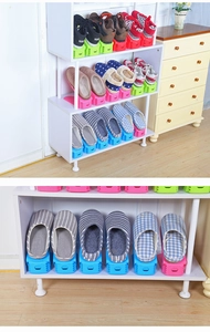 Detail showing adjustable height side buckles on a durable plastic double shoe rack