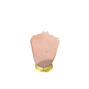 Pink velvet jewelry bust display with a gold metal base for necklaces and pendants