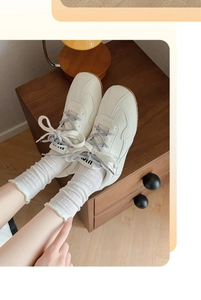 Macro view of white breathable wood ear edge mesh mid-calf slouch socks for women