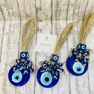 Three-piece Turkish Evil Eye glass charms with traditional blue concentric circles and ropes