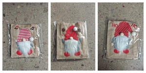 Three Christmas burlap gift bags featuring gnome designs with red hats and white pompoms