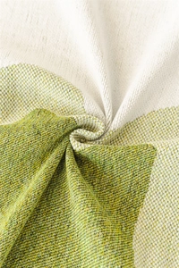 Macro shot of Nordic chenille fabric texture with green and beige jacquard pattern
