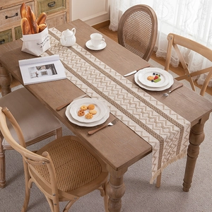 Boho woven cotton linen table runner with geometric stripe patterns and fringe tassels