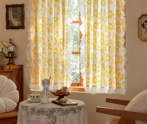 Floral cotton cafe curtain with white ruffle edge in a cozy cottagecore interior setup