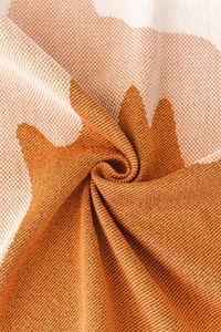 Macro texture of Nordic chenille sofa cover with orange and cream woven geometric patterns