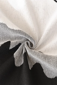 Macro detail of Nordic chenille throw showing soft jacquard weave and geometric patterns