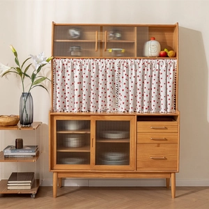 Cotton printed kitchen door curtain on a wooden storage cabinet with sliding glass doors