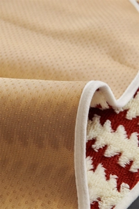 Close-up of jacquard sofa cushion showing snowflake pattern and non-slip silicone backing