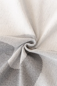 Macro detail of Nordic chenille sofa cover with thick woven geometric texture in grey