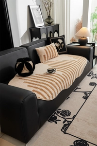 Detail of jacquard non-slip sofa cushion with textured wave pattern and matching pillow