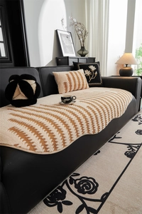 Detail of thickened plush sofa cover with wave texture and anti-slip edging