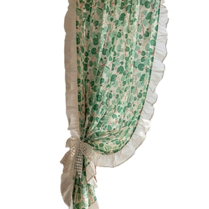 Floral cotton curtain with green leaf print and white ruffle edge with lace tie
