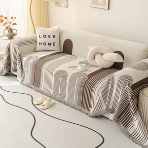 Nordic chenille sofa cover with brown geometric arch patterns and grey fringe trim