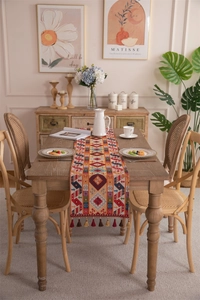 Close-up of bohemian jacquard table runner with geometric patterns and fringe tassels