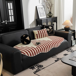 Striped red and white jacquard sofa cushion with wavy edges and floral accent pillows