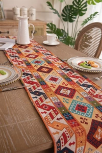 Detail of bohemian geometric woven table runner with colorful ethnic patterns and tassels