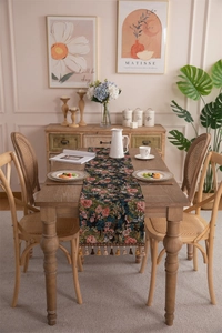 Detail of vintage jacquard table runner with floral pattern and hanging tassels
