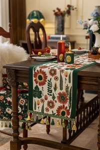 Detailed view of vintage jacquard table runner with sunflower patterns and colorful tassels