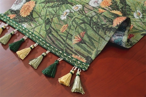 Close-up of American pastoral jacquard table runner with daisy pattern and colorful tassels