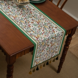 American retro floral table runner with ethnic jacquard design and tassels for home decor