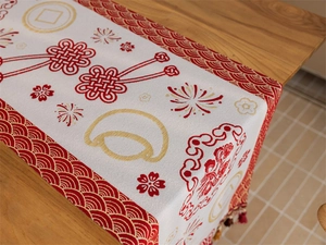 Detail of red and white jacquard table runner with festive Chinese knot and sycee patterns