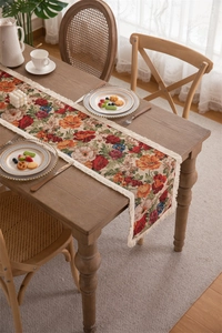 Macro detail of vintage floral jacquard fabric with elegant handmade tassels on the edge