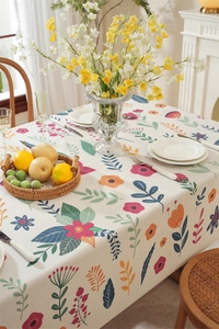 Detail of colorful floral and leaf pattern on rectangular linen-blend Easter tablecloth