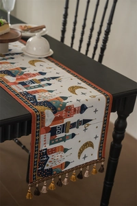 Close-up of jacquard table runner with mosque moon prints and colorful tassels