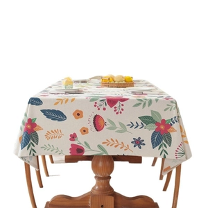 Easter table runner with colorful floral rabbit prints and elegant tassels on wood