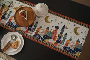 Macro detail of Middle Eastern table runner with woven mosque, moon and star patterns