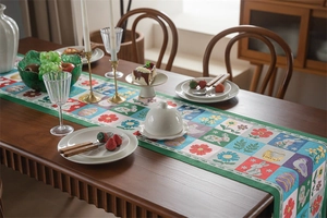Detail of Easter table runner with bunny and egg patchwork on a wooden dining table