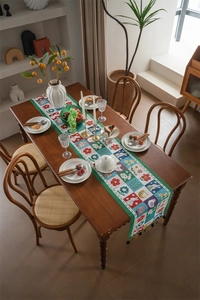Detailed close-up of woven Easter table runner featuring bunnies, eggs, and tassels
