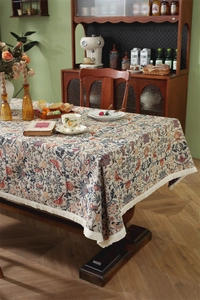 Close-up of retro floral jacquard pattern and white tassel fringe on the tablecloth