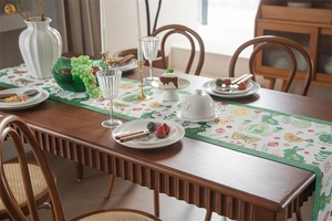 Detailed texture of Easter table runner with bunny, floral patterns and green borders