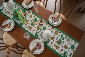 Close-up of Easter table runner with bunny and egg jacquard patterns on wooden table