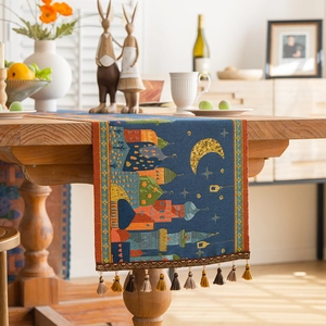 Navy blue jacquard table runner with golden moon, stars, and castle fringe details