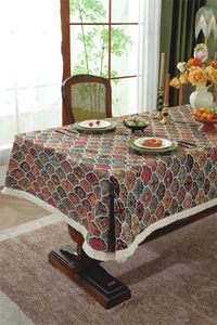 Close-up of bohemian mandala pattern with elegant white tassels on woven tablecloth