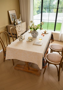Detail of bohemian jacquard tablecloth with ethnic floral border and leaf texture